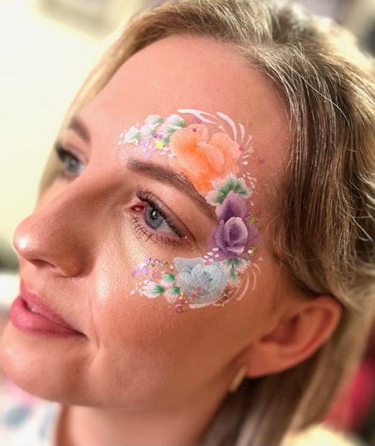 lady with flowers painted around her face in Shifnal
